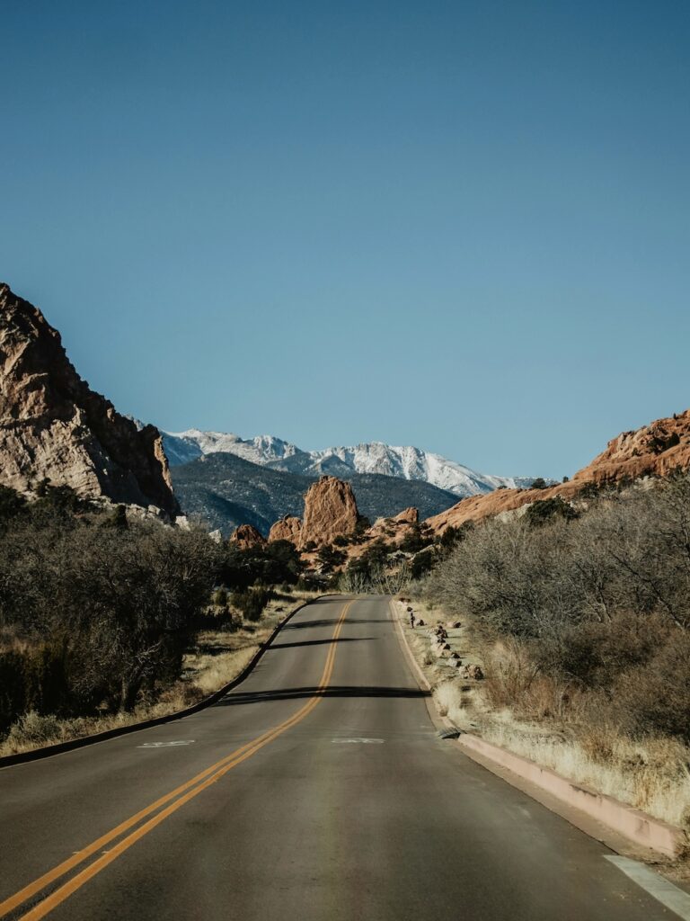 empty two lane road through the mountains of colorado.
